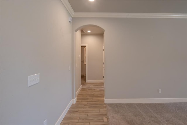 12037 Ashford Dr, Yukon, OK 73099 - hallway featuring arched walkways, crown molding, light wood-type flooring, and recessed lighting