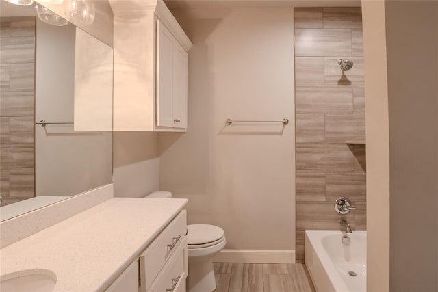 12037 Ashford Dr, Yukon, OK 73099 - bathroom featuring vanity and bathing tub / shower combination