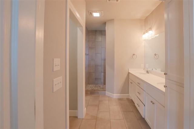 12037 Ashford Dr, Yukon, OK 73099 - full bath with tile patterned flooring, double vanity, and a walk in shower