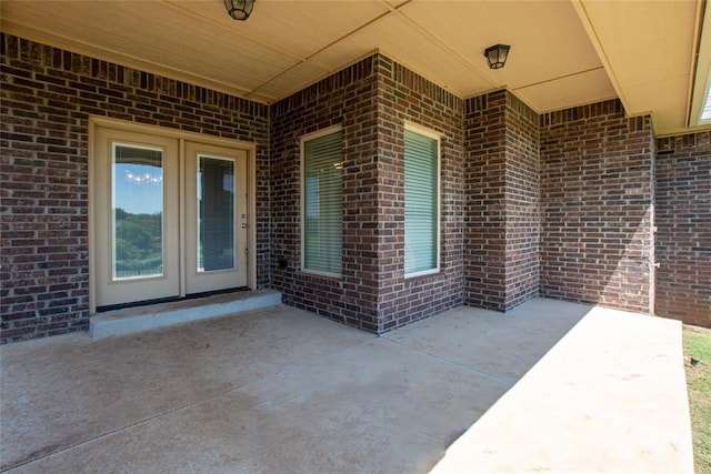 12037 Ashford Dr, Yukon, OK 73099 - view of patio / terrace with french doors