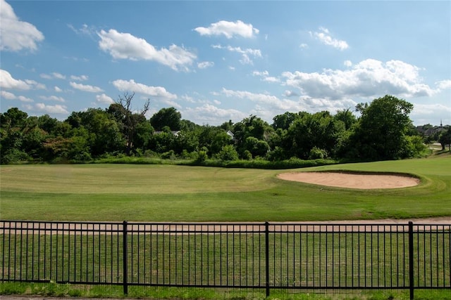 12037 Ashford Dr, Yukon, OK 73099 - surrounding community featuring view of golf course and view of wooded area