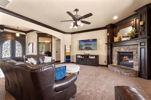 126 Castle Gate Dr, Choctaw, OK 73020 - carpeted living area with arched walkways, a ceiling fan, a fireplace, ornamental molding, and french doors