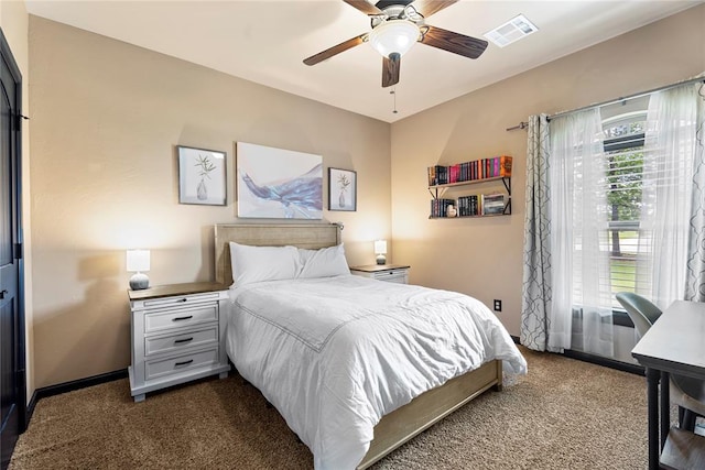 126 Castle Gate Dr, Choctaw, OK 73020 - bedroom with dark carpet and a ceiling fan