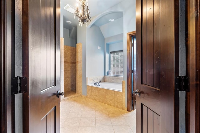126 Castle Gate Dr, Choctaw, OK 73020 - full bathroom with tile patterned floors, a garden tub, vaulted ceiling, and a chandelier