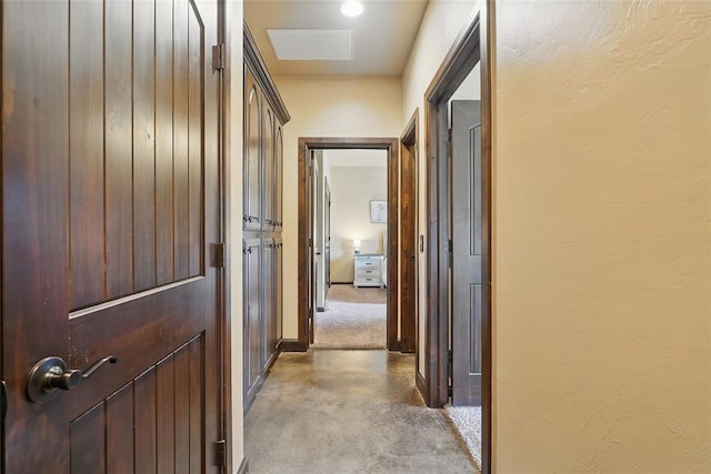 126 Castle Gate Dr, Choctaw, OK 73020 - hallway with finished concrete flooring and baseboards