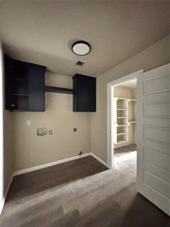1822 N Jordan Ave, Oklahoma City, OK 73111 - laundry room featuring baseboards and dark wood-style floors