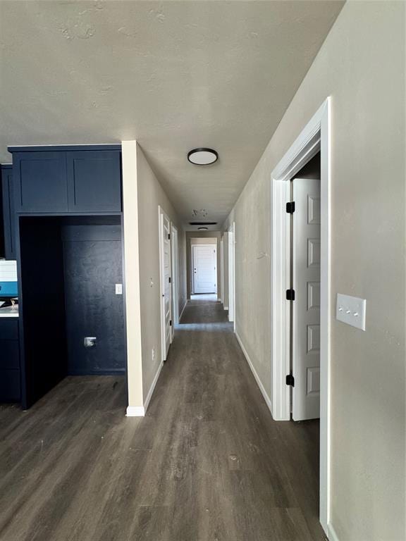 1822 N Jordan Ave, Oklahoma City, OK 73111 - corridor featuring dark wood-type flooring and baseboards