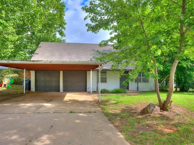 8533 SW 76th St, Oklahoma City, OK 73169 - view of front of house featuring a garage, brick siding, driveway, roof with shingles, and a front yard