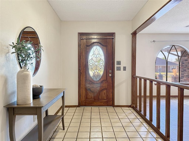 10300 Ryecroft Rd, Oklahoma City, OK 73162 - entrance foyer with a textured ceiling and light tile patterned floors