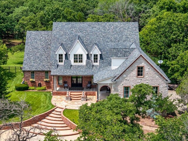 10035 Stone Gate Way, Arcadia, OK 73007 - view of front of property with brick siding and a wooded view
