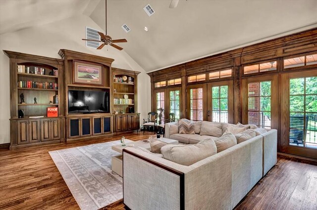 10035 Stone Gate Way, Arcadia, OK 73007 - living area with a ceiling fan, dark wood finished floors, high vaulted ceiling, and french doors