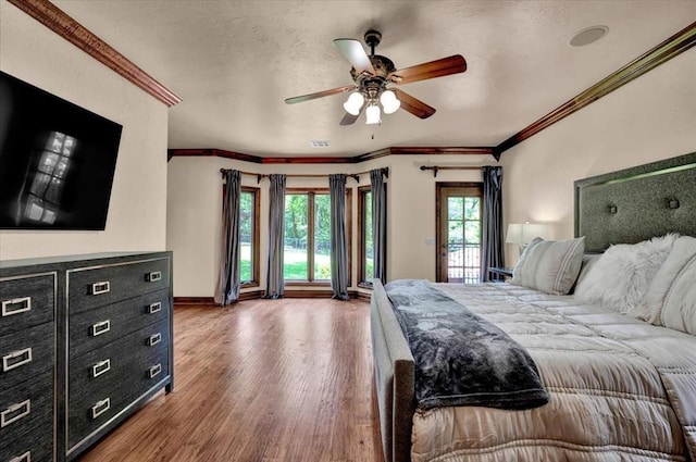 10035 Stone Gate Way, Arcadia, OK 73007 - bedroom with access to outside, wood finished floors, crown molding, and ceiling fan