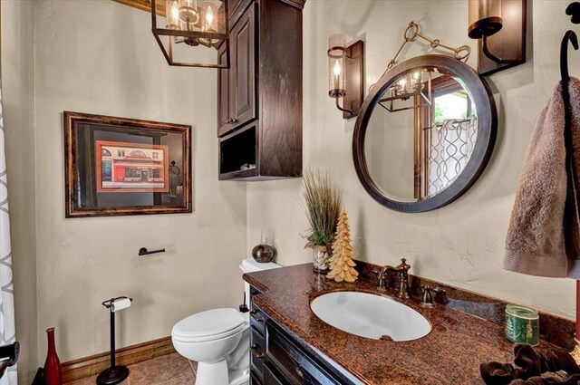 10035 Stone Gate Way, Arcadia, OK 73007 - half bath with a chandelier, vanity, and tile patterned flooring