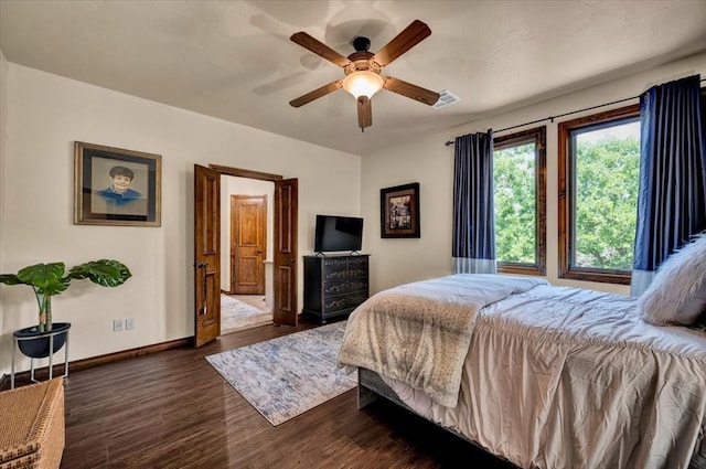 10035 Stone Gate Way, Arcadia, OK 73007 - bedroom with dark wood finished floors and a ceiling fan