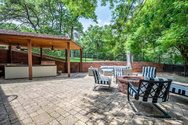 10035 Stone Gate Way, Arcadia, OK 73007 - view of patio / terrace with an outdoor fire pit and a ceiling fan