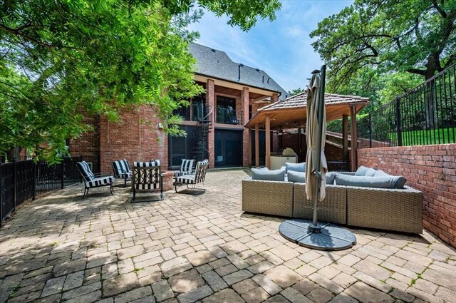 10035 Stone Gate Way, Arcadia, OK 73007 - fenced backyard featuring a gazebo, an outdoor hangout area, and a patio area
