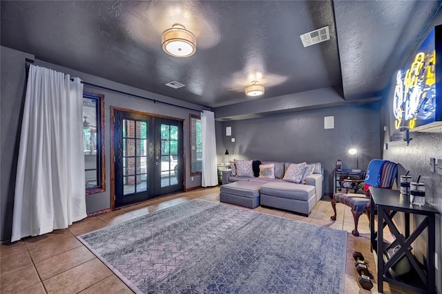 10035 Stone Gate Way, Arcadia, OK 73007 - tiled living room with french doors