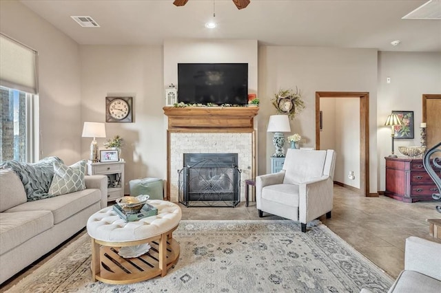 412 Swingman Rd, Yukon, OK 73099 - tiled living room with ceiling fan and a fireplace