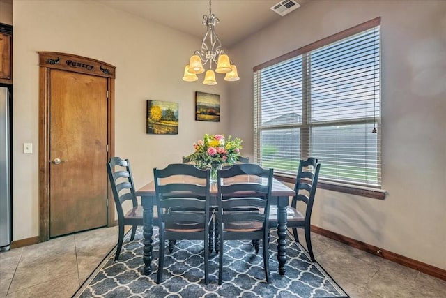 412 Swingman Rd, Yukon, OK 73099 - dining space with a chandelier and light tile patterned floors