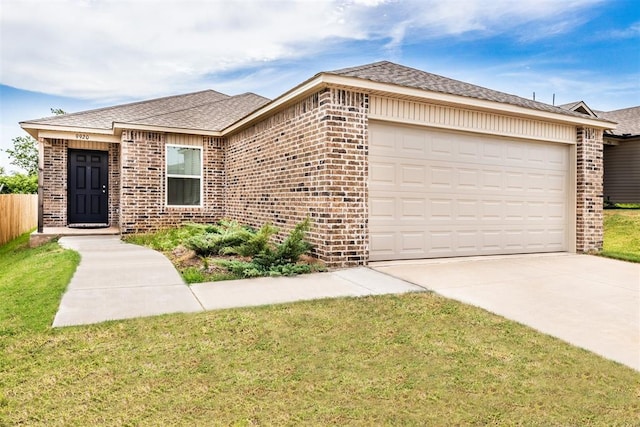 9920 Black Bear Trl, Yukon, OK 73099 - ranch-style house with brick siding, a garage, roof with shingles, driveway, and a front yard