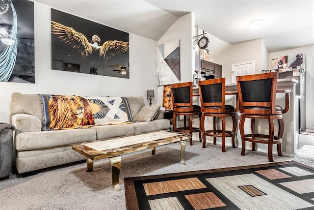 9920 Black Bear Trl, Yukon, OK 73099 - carpeted living room with vaulted ceiling and a ceiling fan