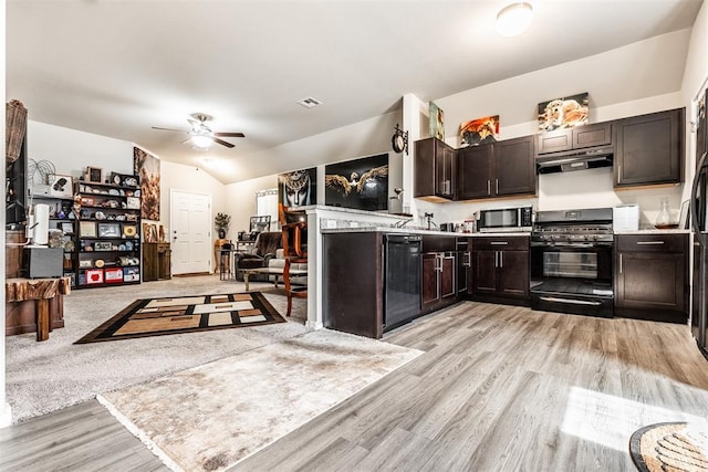 9920 Black Bear Trl, Yukon, OK 73099 - kitchen with black appliances, under cabinet range hood, a ceiling fan, light wood finished floors, and lofted ceiling