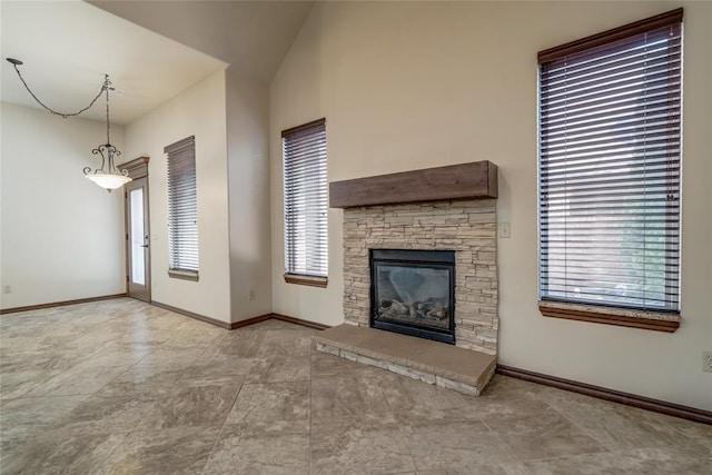 2216 SW 117th St, Oklahoma City, OK 73170 - unfurnished living room featuring a fireplace and baseboards