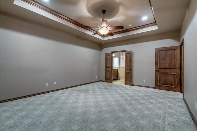 2216 SW 117th St, Oklahoma City, OK 73170 - unfurnished bedroom featuring a tray ceiling, carpet floors, ceiling fan, and connected bathroom