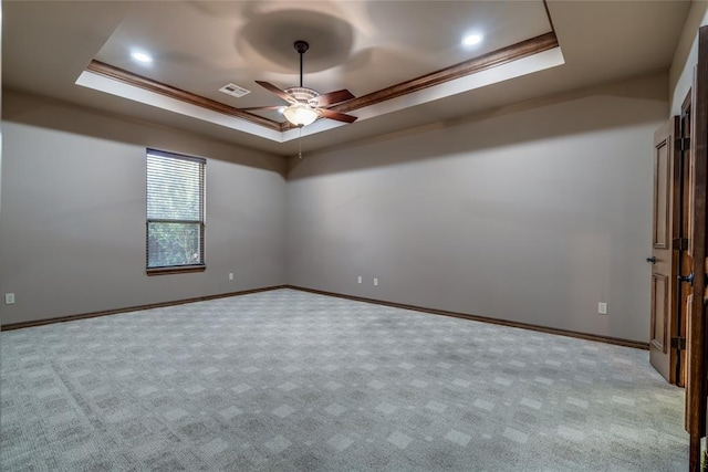 2216 SW 117th St, Oklahoma City, OK 73170 - carpeted spare room with a raised ceiling, a ceiling fan, and crown molding