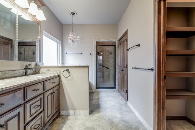 2216 SW 117th St, Oklahoma City, OK 73170 - full bathroom with vanity, a shower stall, a chandelier, and tile patterned floors