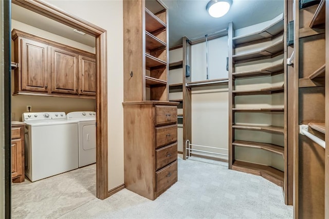 2216 SW 117th St, Oklahoma City, OK 73170 - laundry room featuring cabinet space and washing machine and clothes dryer