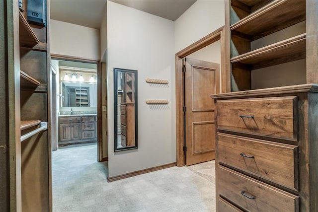 2216 SW 117th St, Oklahoma City, OK 73170 - walk in closet featuring light colored carpet