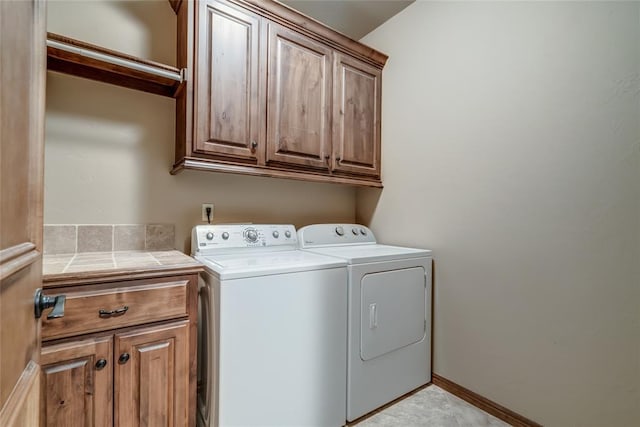 2216 SW 117th St, Oklahoma City, OK 73170 - washroom featuring cabinet space and washing machine and dryer