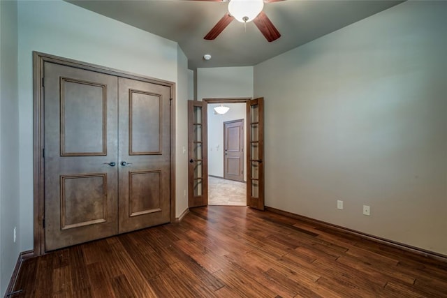 2216 SW 117th St, Oklahoma City, OK 73170 - unfurnished bedroom with dark wood-style flooring, a ceiling fan, and a closet