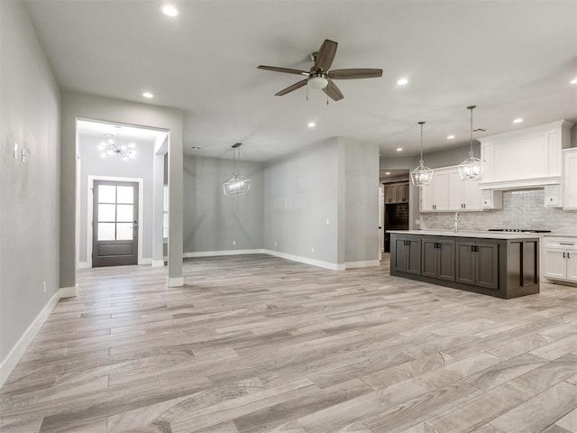 8520 NW 123rd St, Oklahoma City, OK 73142 - kitchen featuring a chandelier, white cabinetry, recessed lighting, and open floor plan