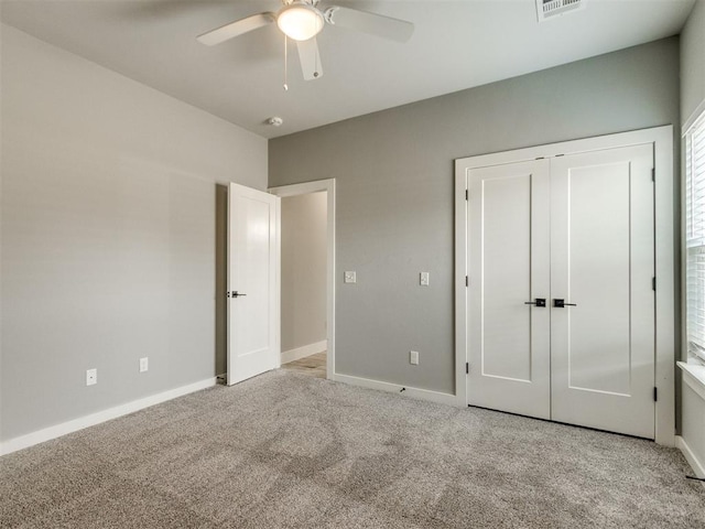 8520 NW 123rd St, Oklahoma City, OK 73142 - unfurnished bedroom with light carpet, a ceiling fan, and a closet