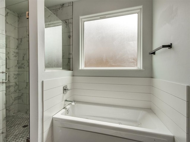 8520 NW 123rd St, Oklahoma City, OK 73142 - bathroom featuring healthy amount of natural light, a jetted tub, and a shower stall
