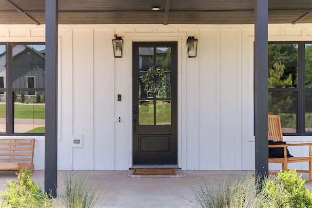 416 Old Creek Rd, Edmond, OK 73034 - entrance to property featuring board and batten siding and covered porch