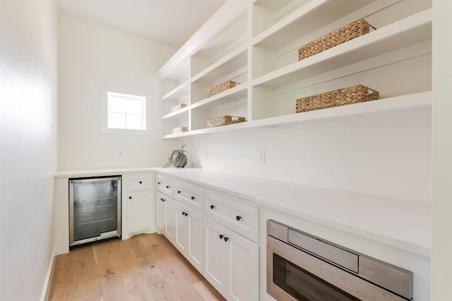 416 Old Creek Rd, Edmond, OK 73034 - indoor dry bar featuring wine cooler and light wood-style flooring