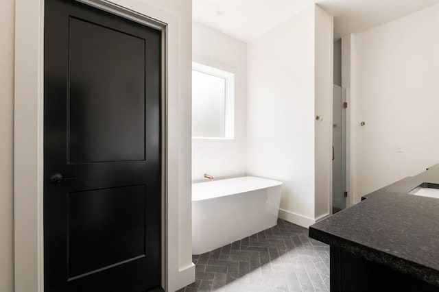 416 Old Creek Rd, Edmond, OK 73034 - bathroom with a freestanding tub and vanity