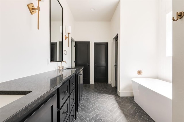 416 Old Creek Rd, Edmond, OK 73034 - full bathroom featuring brick floors, double vanity, and a freestanding tub