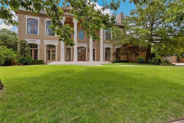 4800 Bocage Pl, Oklahoma City, OK 73142 - back of property with a lawn, a chimney, and french doors
