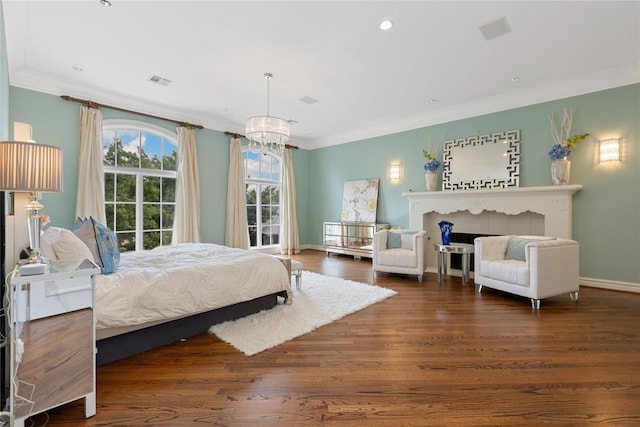4800 Bocage Pl, Oklahoma City, OK 73142 - bedroom with crown molding, a chandelier, wood finished floors, a fireplace, and recessed lighting