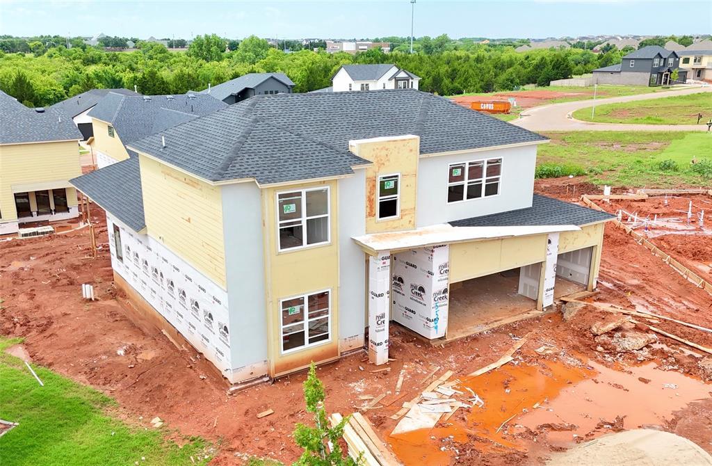 15509 Ceres Pl, Edmond, OK 73013 - view of front facade with a shingled roof and stucco siding