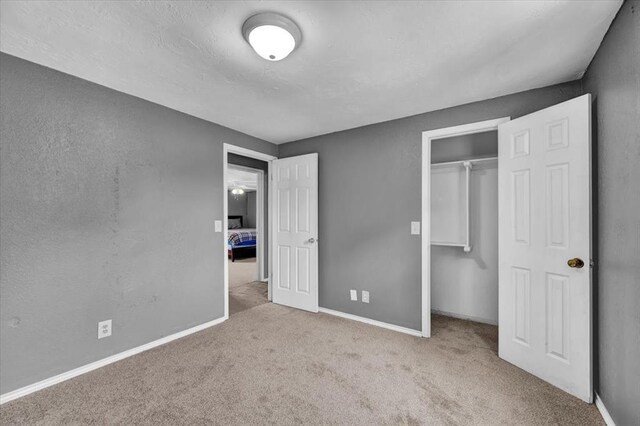 1017 Linn Ln, Yukon, OK 73099 - unfurnished bedroom featuring carpet and a closet
