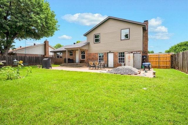 1017 Linn Ln, Yukon, OK 73099 - rear view of house featuring a patio area, a fenced backyard, a chimney, and brick siding