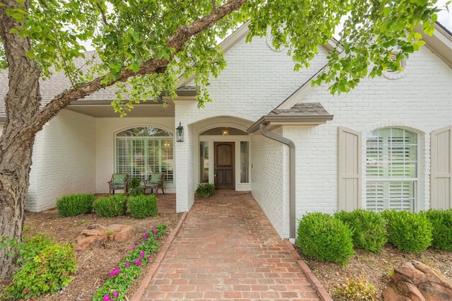 305 Carmel Valley Way, Edmond, OK 73025 - view of exterior entry featuring brick siding