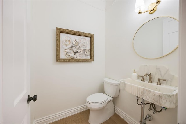 305 Carmel Valley Way, Edmond, OK 73025 - half bathroom featuring toilet and wood finished floors