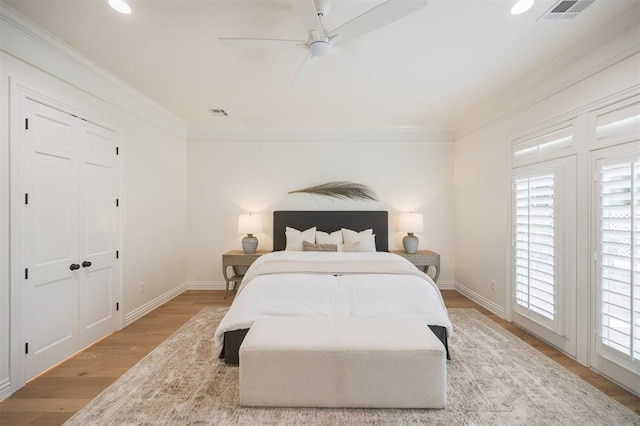 305 Carmel Valley Way, Edmond, OK 73025 - bedroom featuring ornamental molding, light wood-style floors, recessed lighting, and ceiling fan