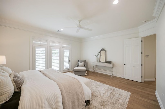 305 Carmel Valley Way, Edmond, OK 73025 - bedroom with crown molding, wood finished floors, recessed lighting, a ceiling fan, and access to exterior